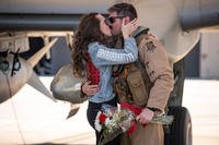 Capt. Daniel Lagomarsino, 75th Fighter Squadron A-10C Thunderbolt II pilot, and girlfriend Kacey Borden share an embrace during a redeployment at Moody Air Force Base, Ga. (Air Force/Andrea Jenkins)