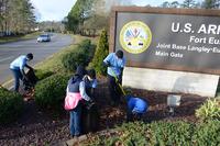Members of the Fort Eustis chapter of the Sergeant Audie Murphy Club clean the area surrounding the Gate 1 entrance at Fort Eustis, Va., Jan. 16, 2016. (U.S. Air Force/Staff Sgt. Jason J. Brown)