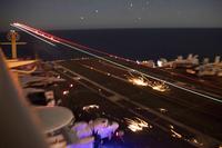 An F/A-18E Super Hornet lands on the flight deck of the Nimitz-class aircraft carrier Abraham Lincoln (CVN 72). The Lincoln Carrier Strike Group is deployed to the U.S. Central Command area of responsibility in order to defend American forces and interests in the region. (U.S. Navy photo by Mass Communication Specialist Seaman Dan Snow)