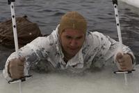 A U.S. Marine with Marine Rotational Force-Europe 19.2, Marine Forces Europe and Africa, uses ski poles to climb out of water during an ice-breaking drill in Setermoen, Norway, on May 4, 2019. The ice-breaking drills tested the Marines’ abilities to get out if they fall in freezing water, ultimately improving the Marine Corps’ cold-weather proficiencies. (U.S. Marine Corps photo by Sgt. Williams Quinteros)