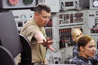Then-Senior Chief Machinist's Mate Mark Szymanski explains the Ship's Control Team Trainer to sailors assigned to Aviation Survival Training Center, Miramar during a tour of Submarine Learning Center, Det. San Diego, April 25, 2013. (U.S. Navy photo/Joseph M. Buliavac)