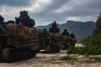 U.S. Marine Corps amphibious assault vehicles assigned to Combat Assault Company, 3d Marine Regiment, travel through beaches prior to conducting a beach assault exercise at Marine Corps Training Area Bellows, Marine Corps Base Hawaii, Apr. 9, 2019. (U.S. Marine Corps photo/Alex Kouns)