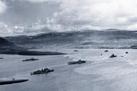 The covering forces of the PQ-17 Convoy (British and American ships) at anchor in the harbor at Hvalfjord, Iceland, May 1942. The convoy left Iceland on June 27, but a large part of the convoy was wiped out by German aircraft from July 1 to 10. (U.S. Navy/ National Archives)