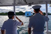 Maj. Gen. Suzanne P. Vares-Lum, left, Mobilization Assistant to the Commander, United States Indo-Pacific Command, and Rear Adm. Robert Chadwick II, right, commander, Navy Region Hawaii and Naval Surface Group Middle Pacific, render honors to the USS Arizona Memorial during a boat tour at Joint Base Pearl Harbor-Hickam, June 29, 2019. (U.S. Navy photo/Charles Oki)