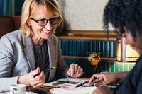 A woman meets with her manager.