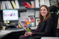 Laura Stanley, a Department of Navy Civilian Employee Assistance Program (DONCEAP) program manager assigned to the Office of Civilian Human Resources, discusses the benefits of DONCEAP at her desk in Washington Navy Yard, Washington, D.C., March 9, 2016. (U.S. Navy/Mark Burrell)