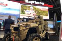 Raytheon's high-energy laser counter-drone system is mounted on a Polaris MRZR all-terrain vehicle at the Association of the United States Army's annual meeting in Washington, D.C., in October 2019. Photo by Hope Hodge Seck