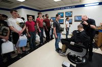 U.S. Air Force basic military training trainees receive haircuts.