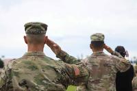 U.S. soldiers render a salute.