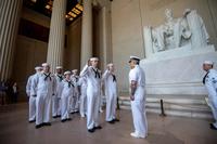 Sailors recite the oath of enlistment during their reenlistment ceremony.