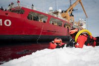 Crew members from the Coast Guard Cutter Polar Star conduct ice rescue training