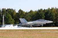 F/A 18 Hornet pilot performs a touch-and-go landing