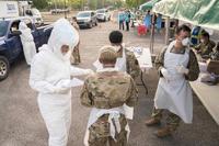 Louisiana National Guard Soldiers and Airmen test first responders for COVID-19.