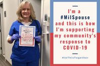 Hollyanne Milley holds a sign about COVID response.