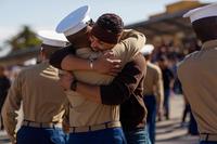Marine is welcomed by a loved one following a graduation ceremony at Marine Corps Recruit Depot San Diego.