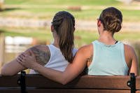 married couple sitting on a bench