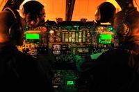 Pilots work their way through pre-flight checklists from the cockpit of a B-1B Lancer.