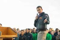 Capt. Brett Crozier,  commanding officer of the aircraft carrier USS Theodore Roosevelt, gives remarks during an all-hands.