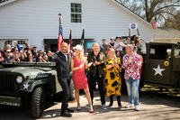 cast posing in front of crowd