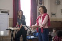 two women preparing to direct a choir