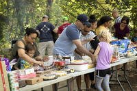 families enjoying outside meal