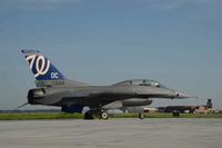 A U.S. Air Force F-16 Falcon with a Washington Nationals logo painted as the tail flash.