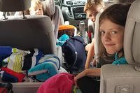 children in car for road trip