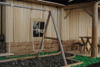 a swing set in front of a house