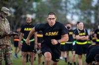 A U.S. Army Reserve maintenance supervisor sprints down a lane.