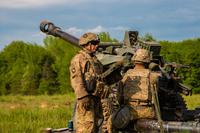 Staff Sgt. Ryan Wertenberger prepares his fire team to fire the M119A3 Howitzer at Fort Campbell.
