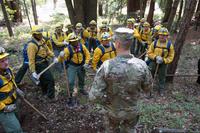 Army Gen. Daniel Hokanson visits with California National Guard members fighting wildfires.