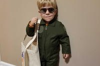 toddler wearing flight suit costume