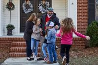 Purple Heart veteran Clint Myatt and his family accept the keys to their mortgage-free home.