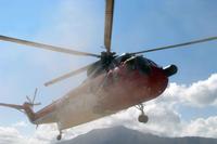 A contract helicopter comes in for a landing in Afghanistan.