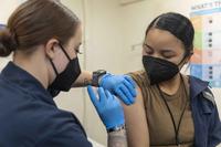 U.S. Navy sailor aboard the USS Iwo Jima receives COVID-19 vaccine.