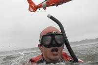 Helicopter rescue swimmer in training