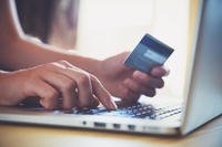 Online shopping on a laptop with credit card