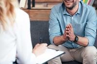 Man in therapy talking with therapist