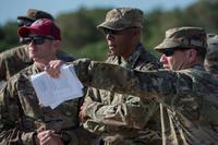 Gen. CQ Brown Jr. listens to a brief at Andersen Air Force Base, Guam.