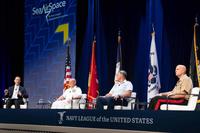 Retired Adm. John Richardson moderates a panel at Sea-Air-Space 2021