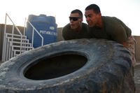 At-home workouts can include flipping a tire.