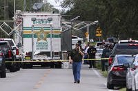 Polk County, Fla., Sheriff's officials at a crime scene.