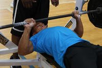 The bench press is a common exercise in military physical fitness training.