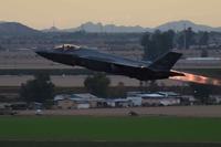 An F-35A Lightning II takes off for an evening sortie