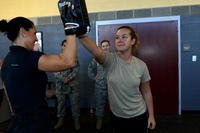 Senior airman demonstrates a self-defense tactic.