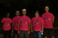 Fort Bragg staffers pose at the finish line of a nighttime run.