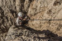 A Marine simulates assaulting a beach.