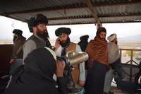 Taliban inspect a U.S.-abandoned telescope in Shkin.