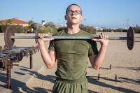 A Marine recruit executes a push press.