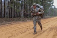 A National Guardsman runs a portion of the 12-mile ruck march during the 2018 Georgia Army National Guard Best Warrior competition.